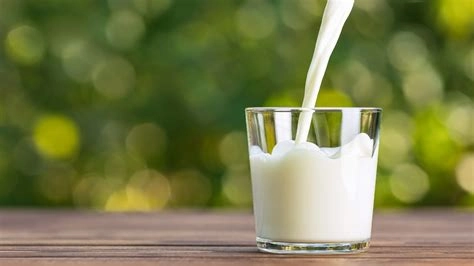glass of milk being poured